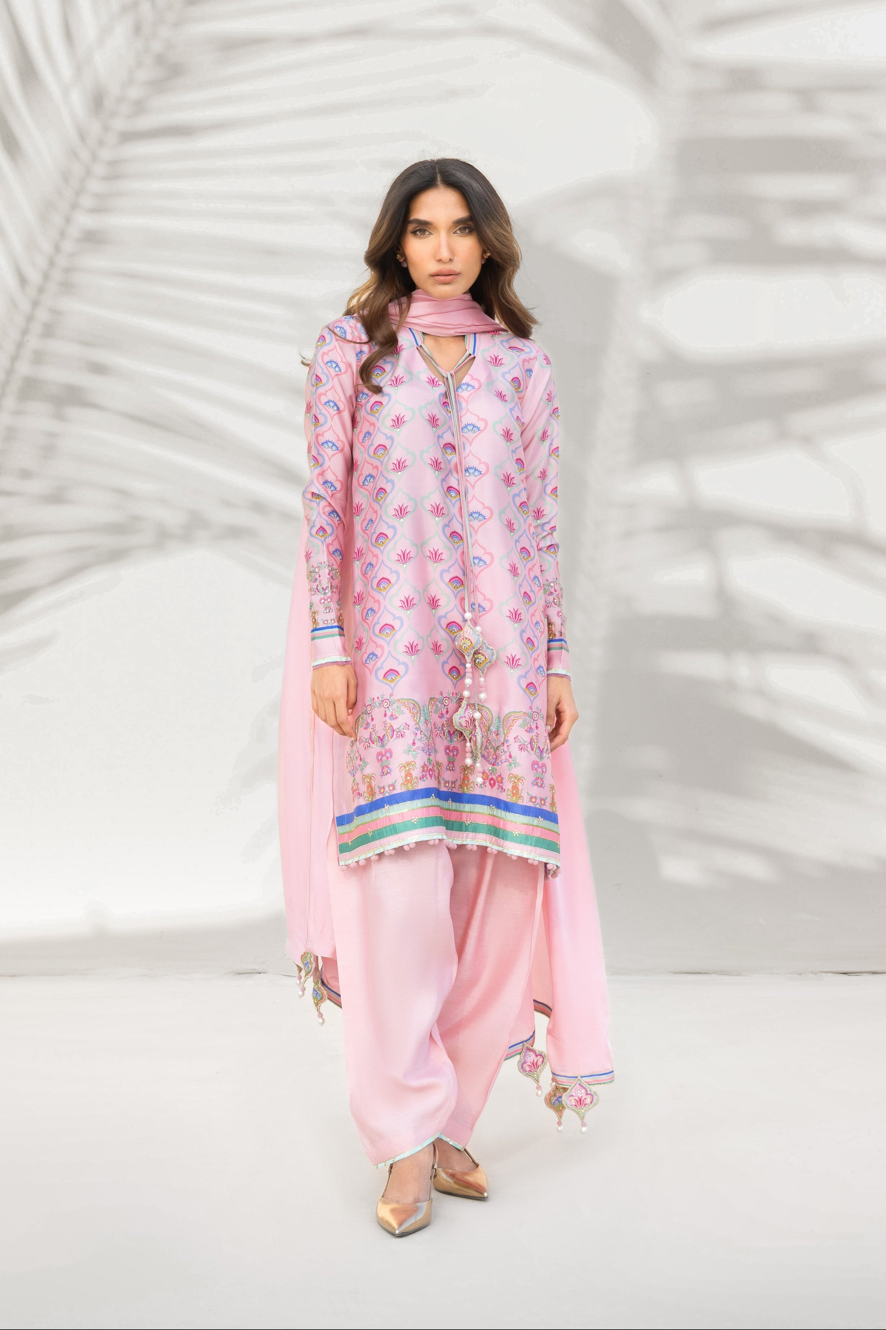 Ariha in blush sheesha silk by La Soie — the fabric's natural sheen and crinkle visible in the drape