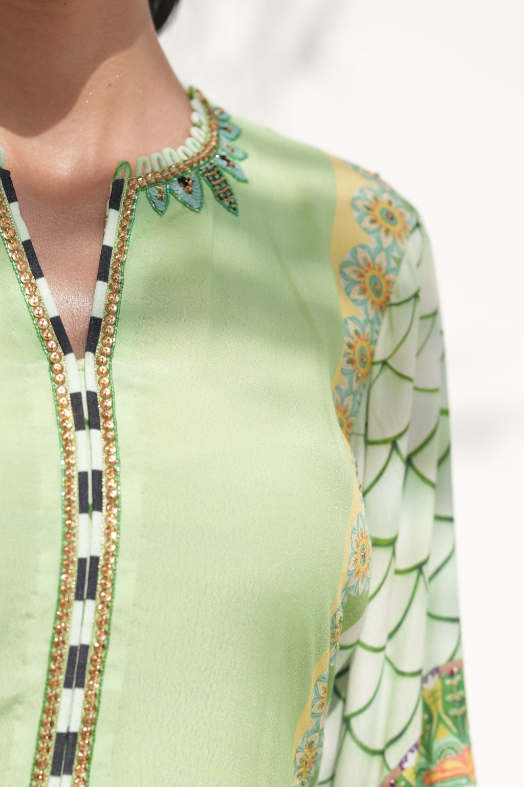 Detail of hand-embellishment on neckline of Aurora Vines