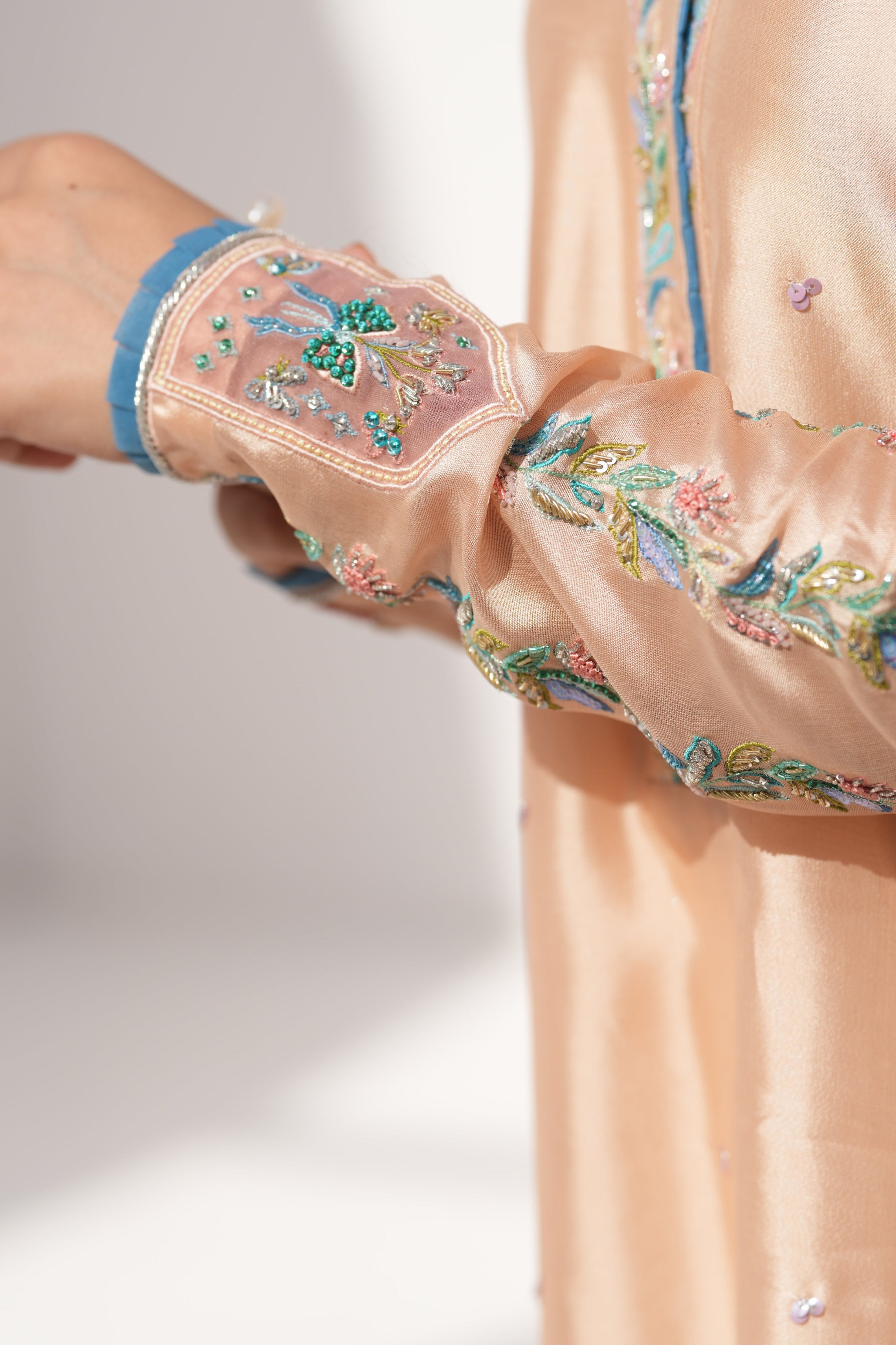 Detail of hand-embellishment on wrist of Coral Drizzle