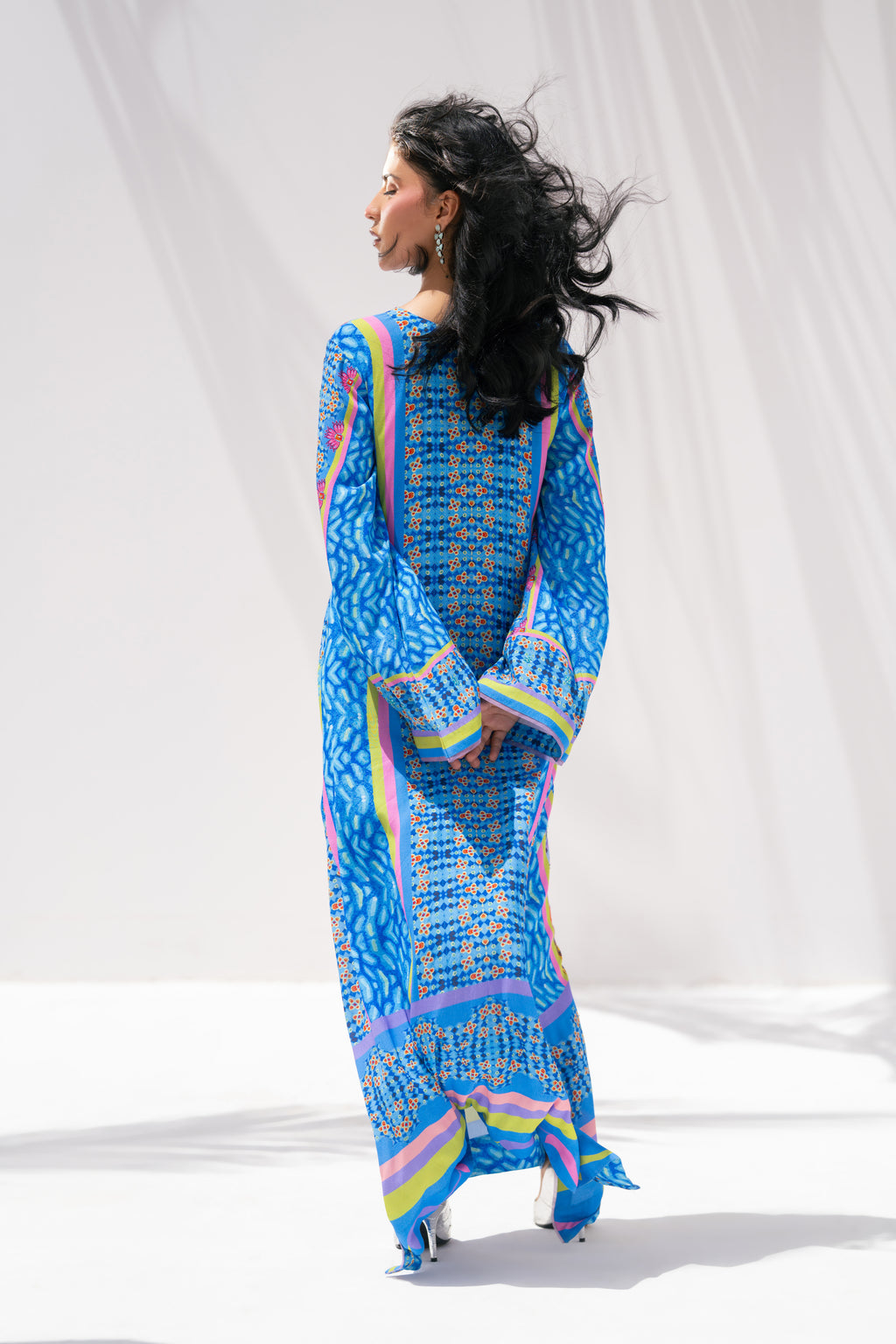 Nova Garden back view showing kaftan silhouette	