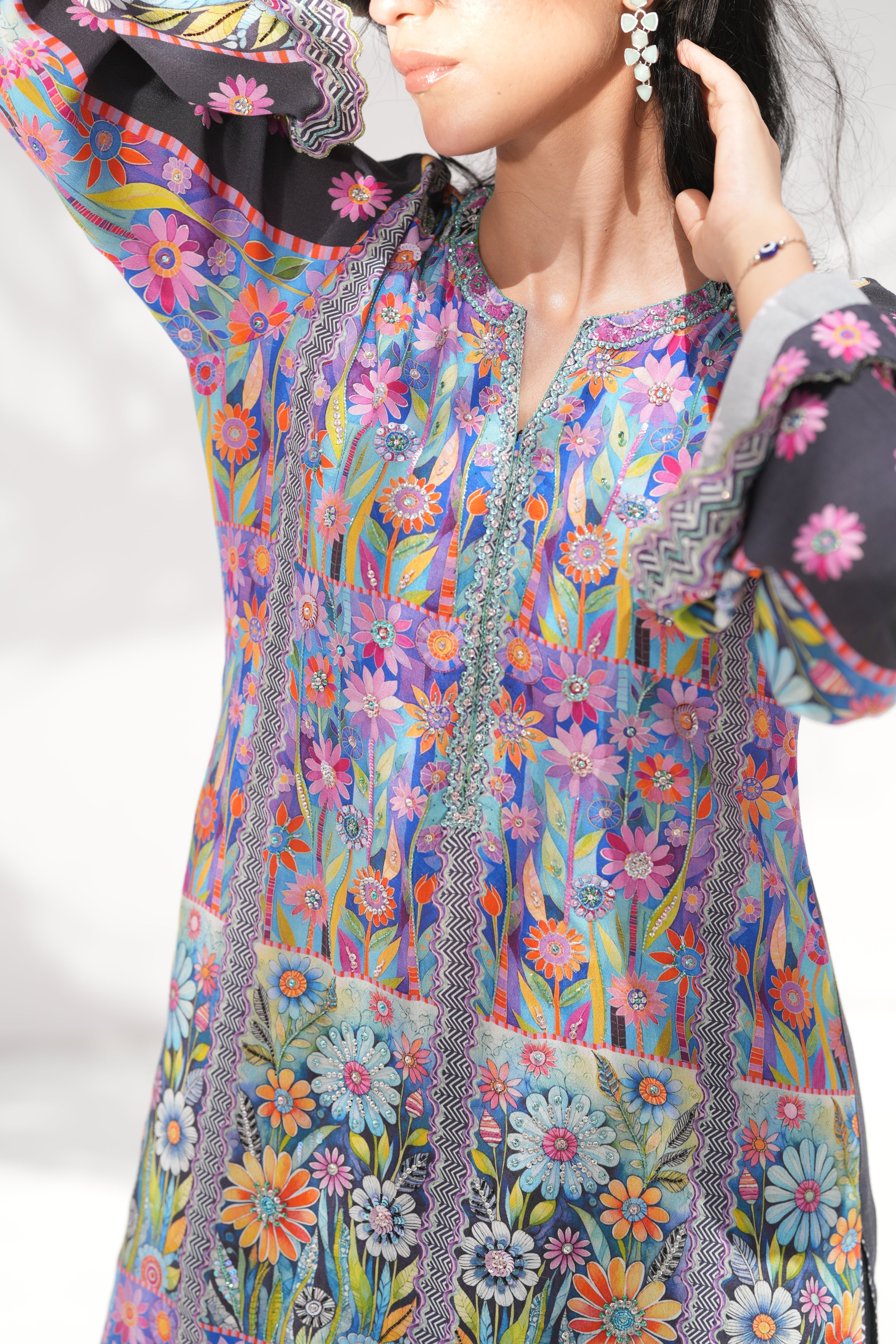 Detail of hand-embellishment on neckline of Mystical Garden	